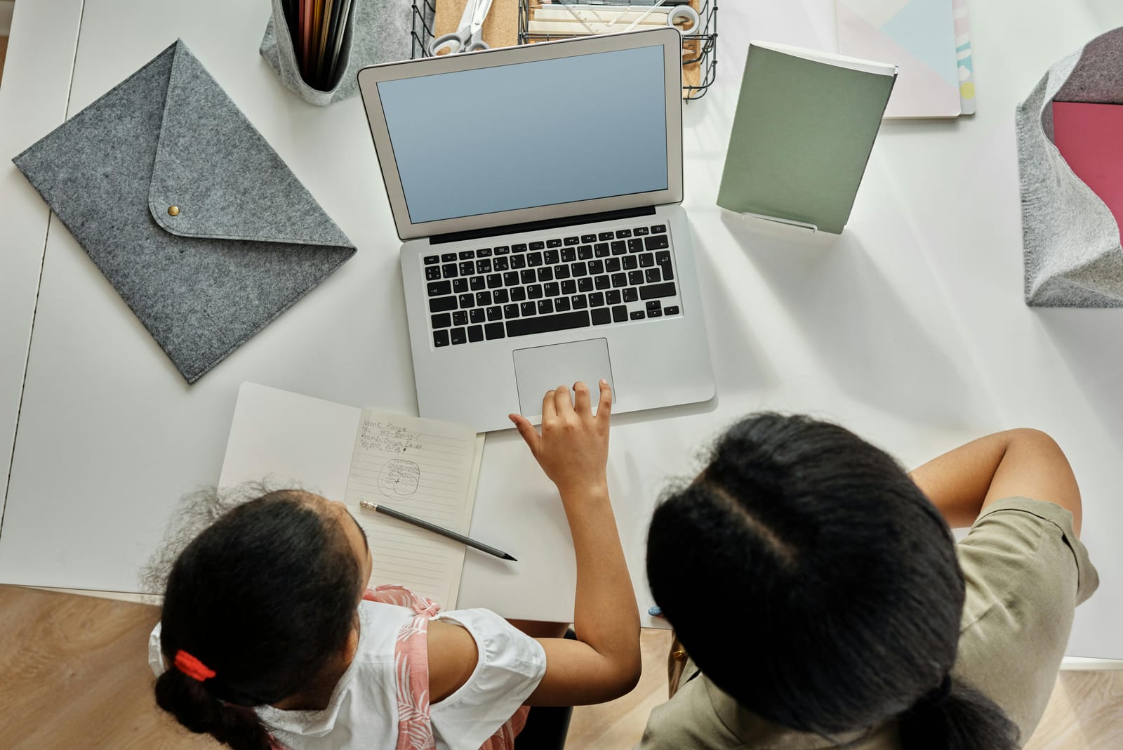 Free Mother Helping her Daughter with Homework Stock Photo